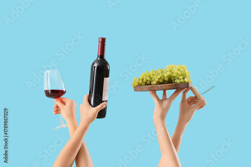 Female hands holding grapes...