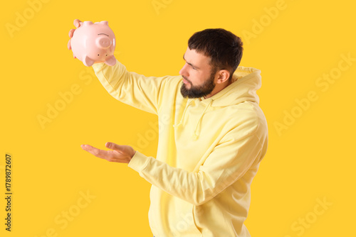 Handsome young displeased m...