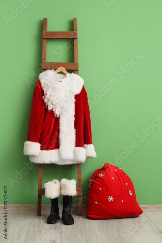 Ladder with Santa costume a...