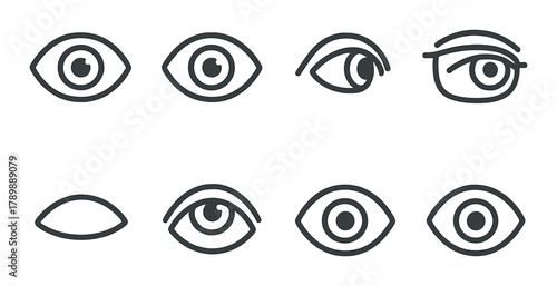 Variety of eye icons set on dark background with different eyeball designs