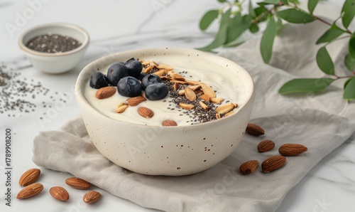 Yogurt bowl with berries almonds and seeds for healthy breakfast concept