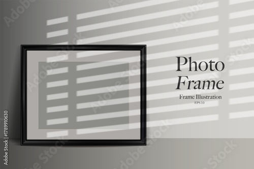 Black horizontal photo frame mockup leaning on a wall. Realistic shadow and light effect.