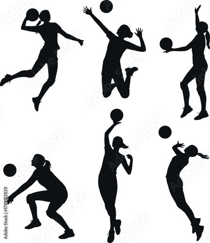 Volleyball players silhouettes in action