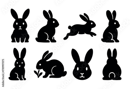Set of eight black silhouette rabbit icons in different poses, including sitting, running, and eating. Perfect for Easter, children's illustrations, or design projects needing a simple, bold rabbit im