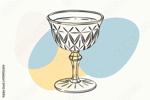 a glass with a yellow liquid inside