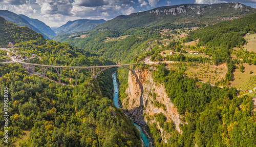 Bild auf Leinwand Tara River Canyon and famous Durdevica Bridge surrounded by lush green forests i