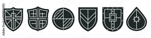 Modern shield icons set featuring diverse geometric designs. Perfect for security, protection, and emblem concepts. Clean black and white symbols for branding