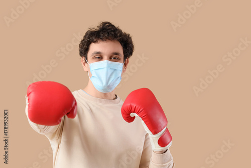 Young man in medical mask w...