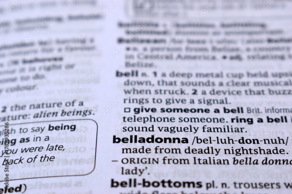 Obraz premium Close Up Of English Dictionary Page With Word - belladonna