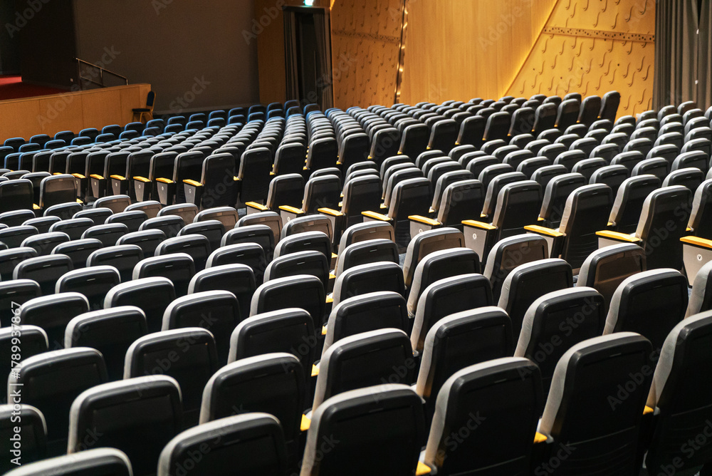 Naklejka premium Empty auditorium with rows of seating