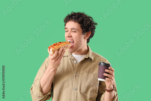 Young man with coffee cup e...