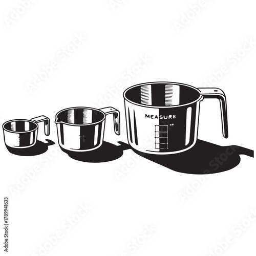 Three gleaming stainless steel measuring cups of varying sizes arranged on a white background