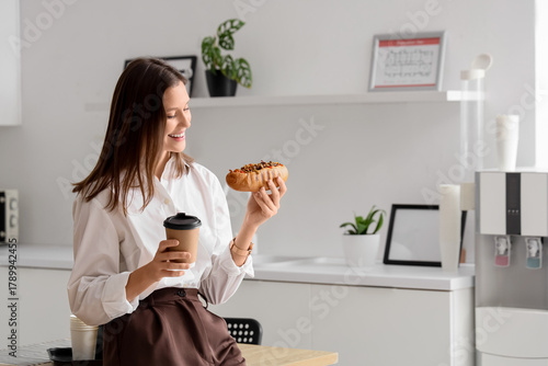 Young businesswoman with co...