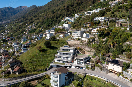 Aerial view of a group of houses in Switzerland in a mountainous part of the south of the country