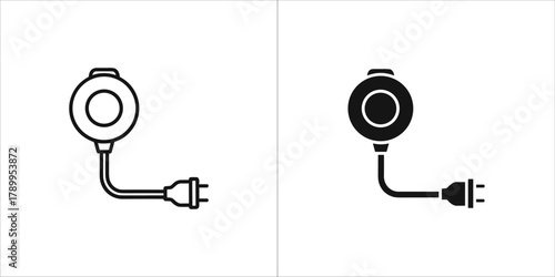 Circular electrical device with power plug icon, representing charging or energy source