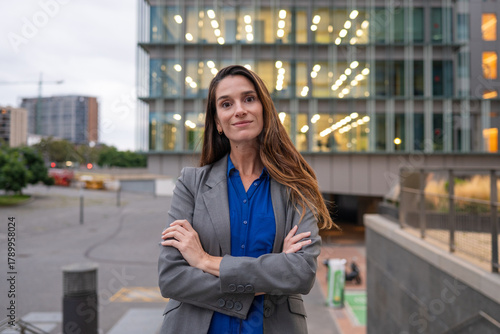 Businesswoman standing confident with arms crossed in city