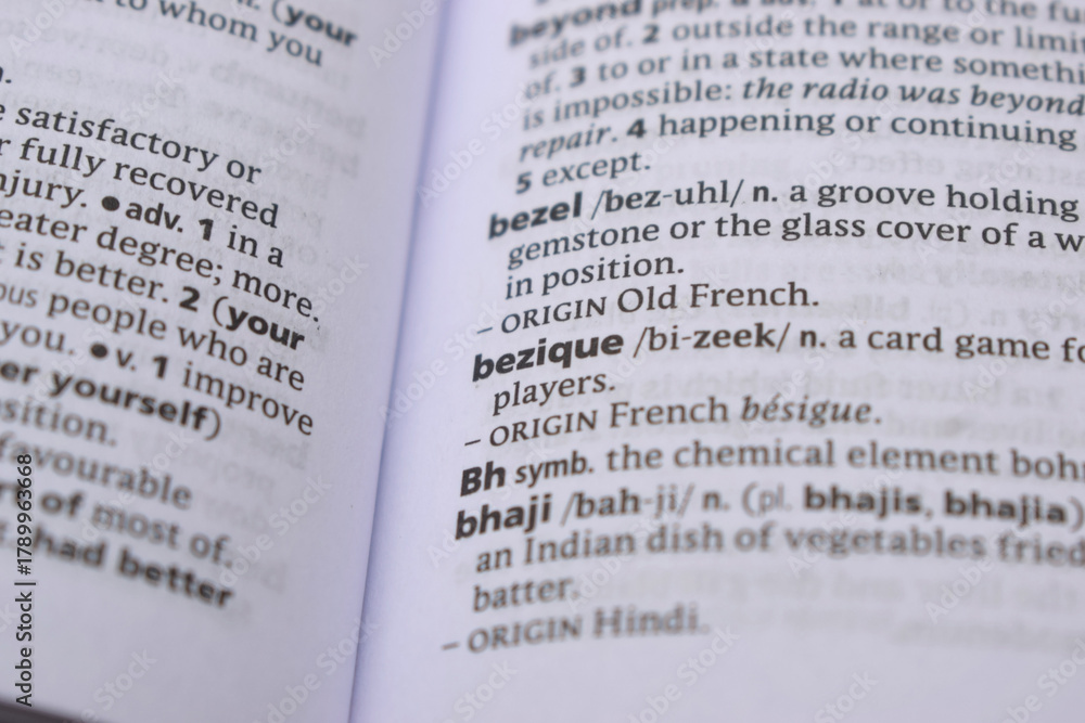 Obraz premium Close Up Of English Dictionary Page With Word - bezique