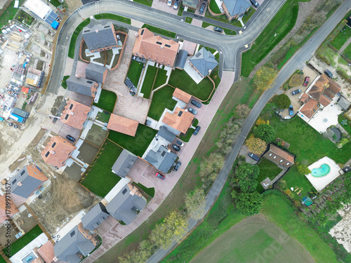 Drone view of a part completed new housing development site in rural Essex, UK. Both affordable and luxury family homes are on the Greenfield site.
