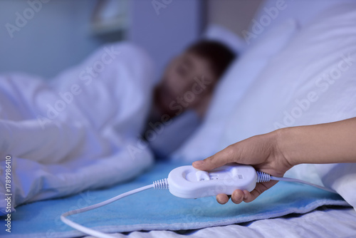 Mother's hand turning on el...
