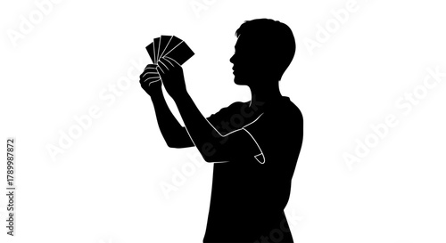 Silhouette with Playing Cards: An enigmatic silhouette holds a hand of cards, its shadow adding intrigue and mystery, creating a scene of contemplation and anticipation.
