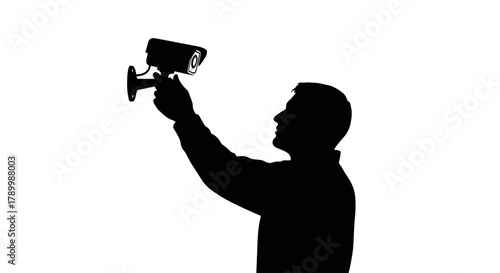 Silhouette's Surveillance: A vigilant silhouette securely installs surveillance technology, symbolizing the protection and safety of the area