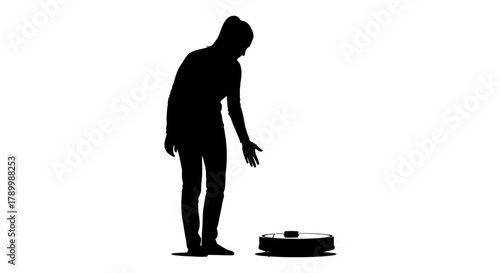 Silhouette of Interaction: A minimalist silhouette of a person interacting with a robotic vacuum cleaner, highlighting the blend of technology and home life.