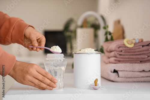 Female hands preparing baby...