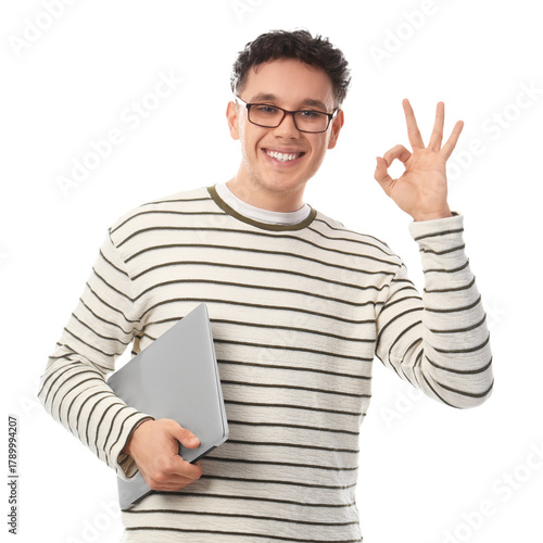 Young man with laptop showi...