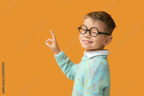 Little boy in eyeglasses sh...