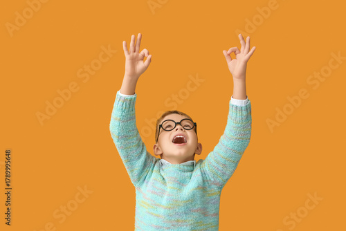 Little boy in eyeglasses sh...