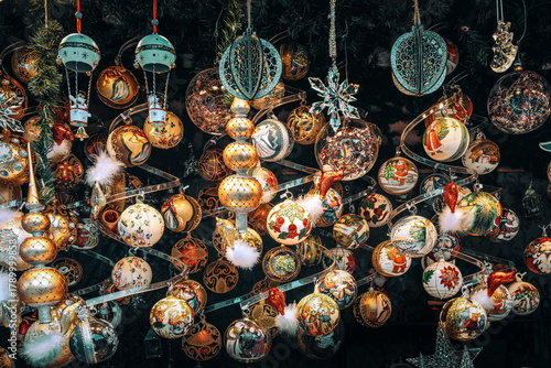 Handmade Christmas baubles hangs from a stall ceiling at the Vienna Christmas market.
