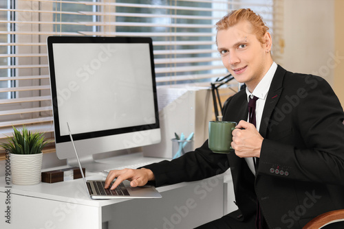 Young businessman working w...