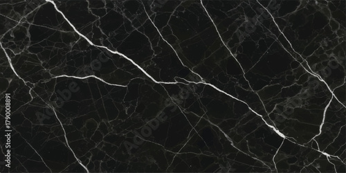 Dead tree branches in the snow create a dark, natural, grunge pattern against the white backdrop