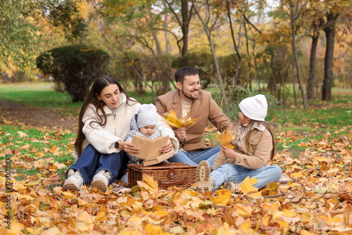 Happy family with autumn le...