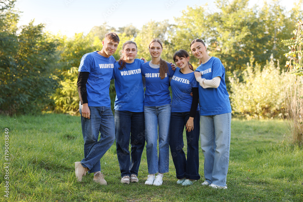Fototapeta premium Group of happy volunteers together in park