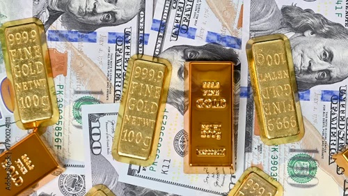 hundred dollar bills with gold bars