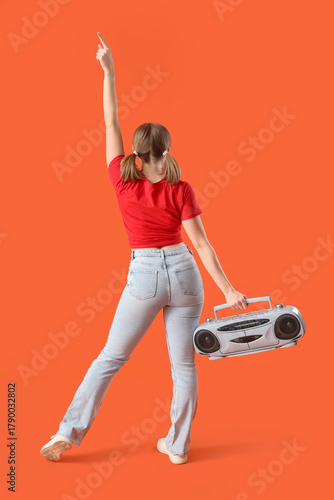 Young woman with boombox da...