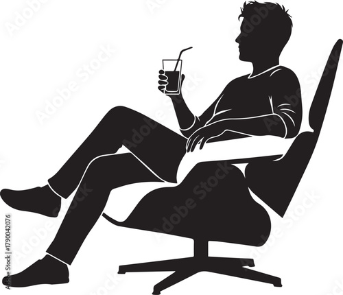 Silhouette of a man relaxing in a modern chair holding a drink with a straw
