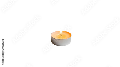 Burning tea light candle isolated on black