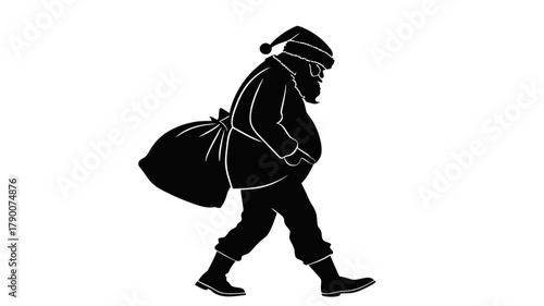 santa silhouette : santa walking with large sack silhouette in a festive winter scene for christmas stock photo