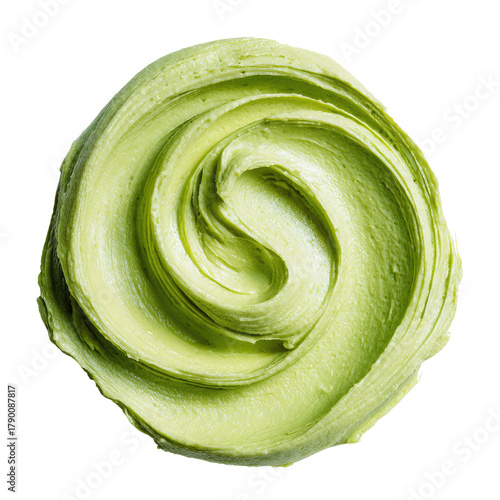 Swirl of light green cream, textured and smooth on dark background