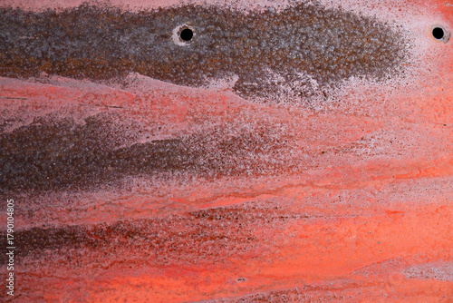 Very old orange metal door with rusty texture