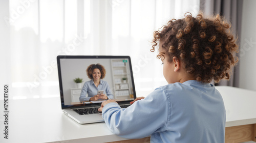 Speech Therapy Session - Preschool Girl with Curly Hair Learning Language Through Online Platform for World Stroke Day Awareness and Communication Recovery