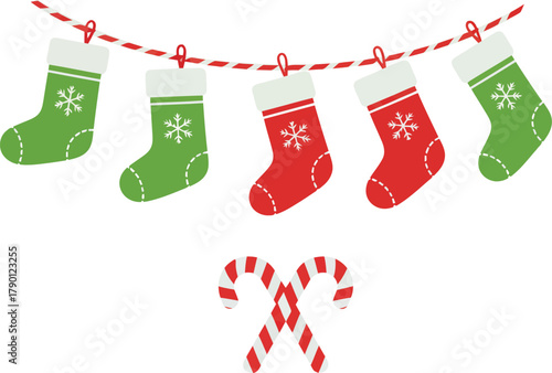 Festive Christmas stockings hanging on a string with candy canes below.
