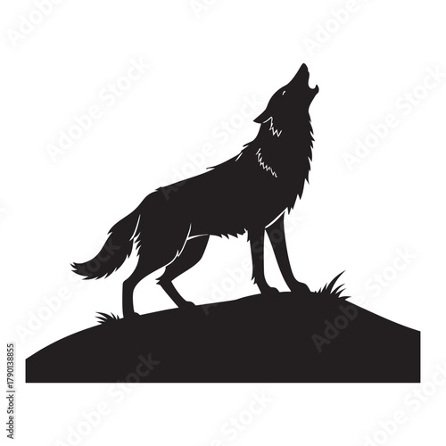 Silhouette of a lone wolf howling at the moon on a grassy hill