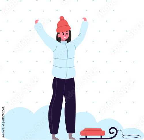 Happy person enjoying winter weather with sled