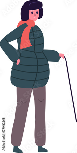 Senior woman walking holding cane during winter