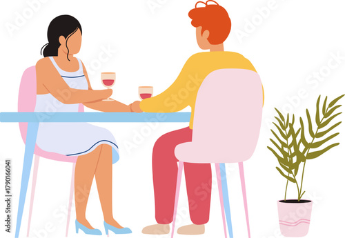 Romantic couple holding hands on date drinking wine