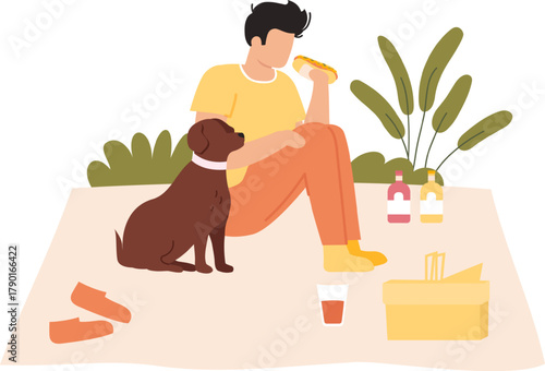 Man having a picnic with his dog eating a hot dog