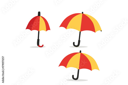 Three striped umbrellas in red and yellow colors of varying sizes